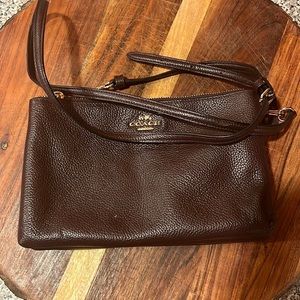 Coach bag with minimal makeup marks on the inside only (as seen in picture).